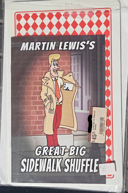 Cardboard box with a cartoon character and text 'Martin Lewis's Great Big Sidewalk Shuffle' on a red and white checkered background.