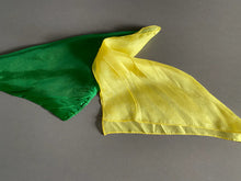 Green and yellow fabric on a gray background