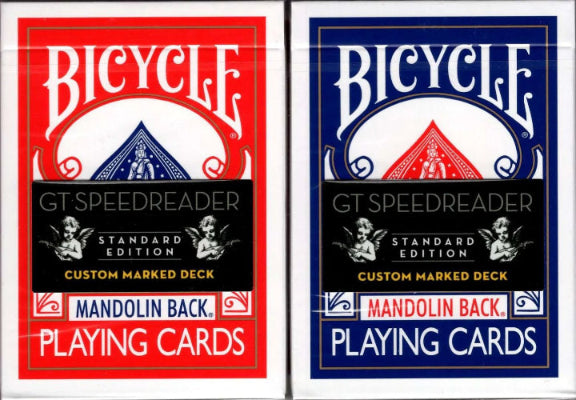 Two Bicycle playing card decks, one red and one blue, on a white background.