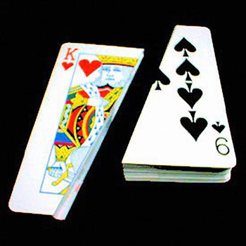 Playing cards including King of Hearts and Ace of Spades on a black background