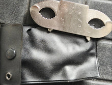 Metal Thumb cuffs on a black leather pouch