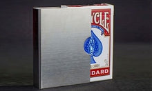Silver metallic box with a red and blue playing card design on a dark background