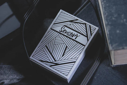 Cardbox with 'Sensory' design on a dark surface